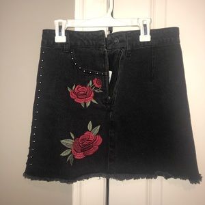 Black studded skirt with red flowers